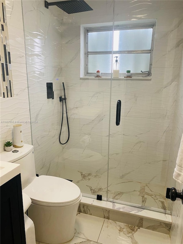 bathroom with vanity, toilet, and an enclosed shower