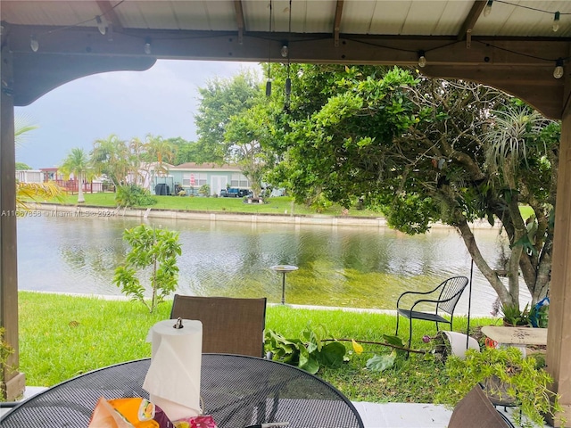 view of patio / terrace with a gazebo and a water view