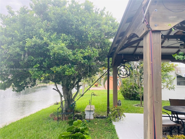 exterior space featuring a gazebo and a water view