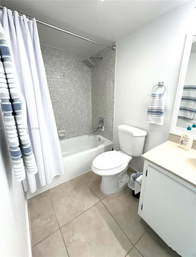 full bathroom with shower / bath combination with curtain, vanity, tile patterned flooring, and toilet