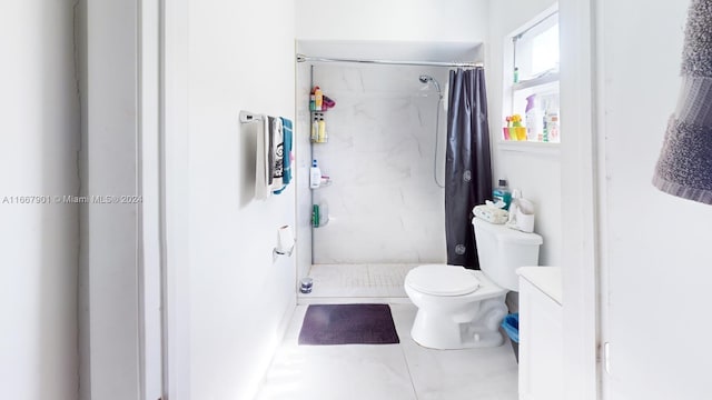 bathroom with toilet, curtained shower, and tile patterned floors