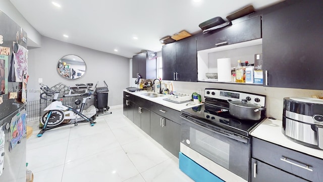 kitchen with sink and electric range