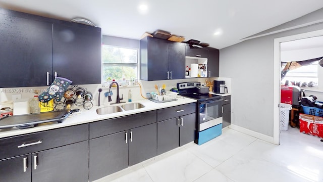 kitchen featuring vaulted ceiling, sink, and stainless steel electric range