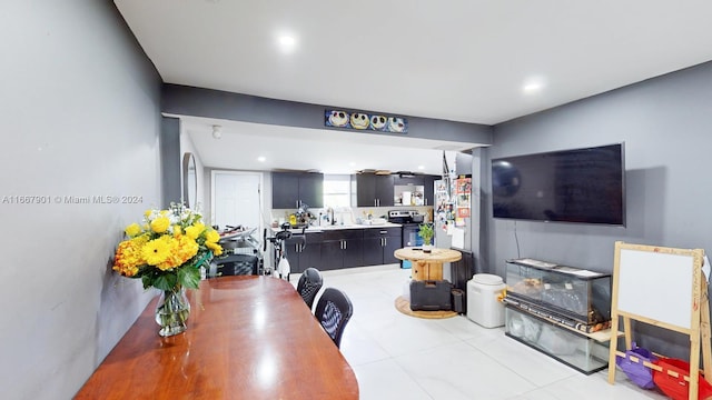 tiled dining room with sink