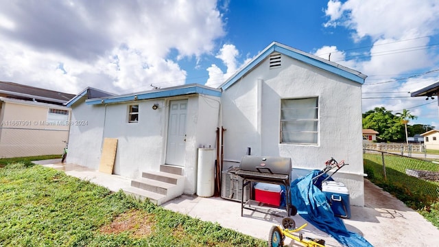 rear view of house with a patio