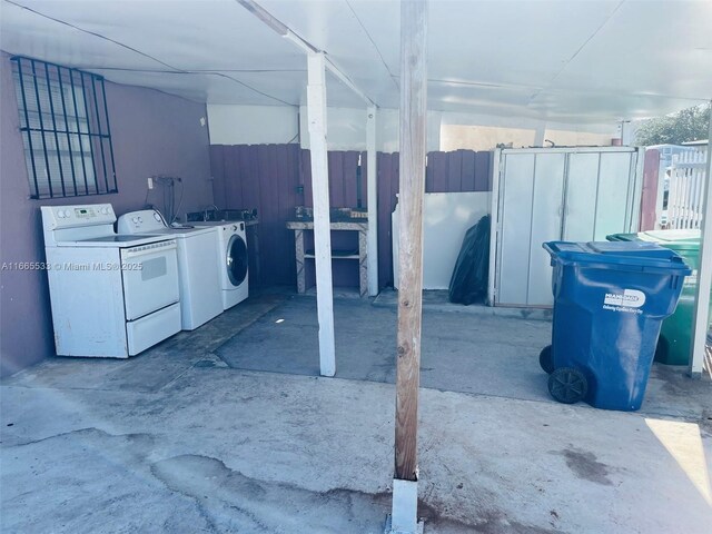 bathroom featuring toilet, vanity, tile patterned floors, and washer / dryer