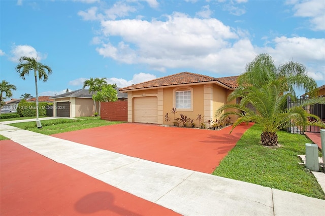 view of front facade with a garage and a front yard