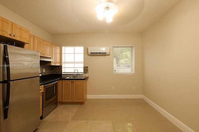 kitchen featuring light brown cabinets, appliances with stainless steel finishes, sink, and an AC wall unit