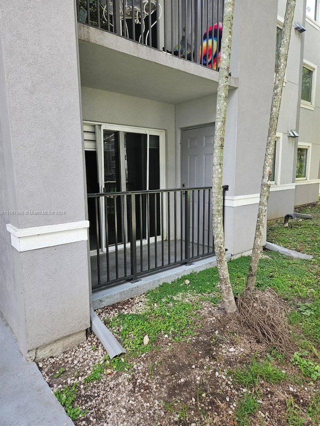 doorway to property with stucco siding