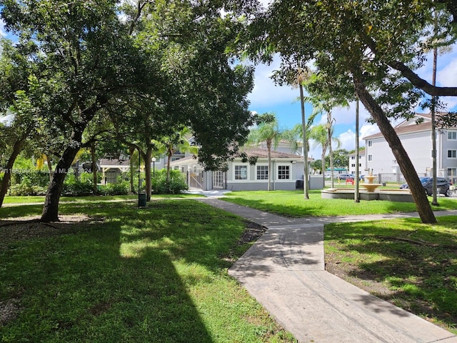 view of home's community featuring a lawn