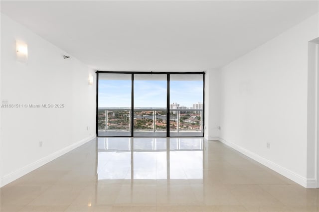 tiled spare room with expansive windows