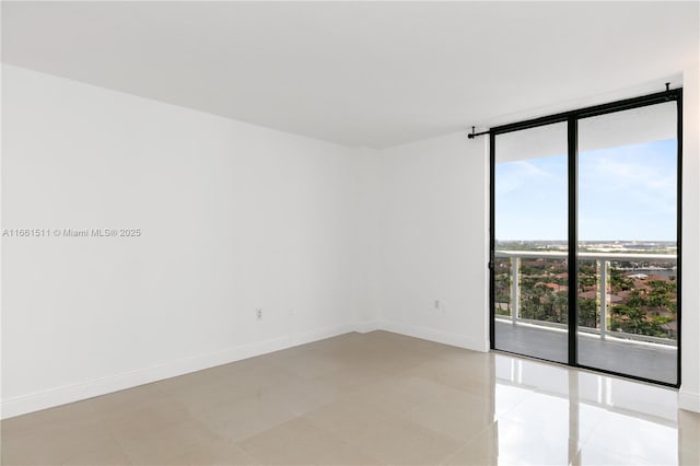 tiled empty room with a wall of windows and plenty of natural light