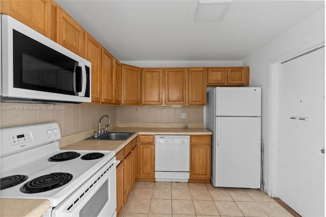 1410 S Ocean Dr Unit 503, Hollywood, FL 33019 - kitchen with white appliances, light countertops, light tile patterned floors, and tasteful backsplash