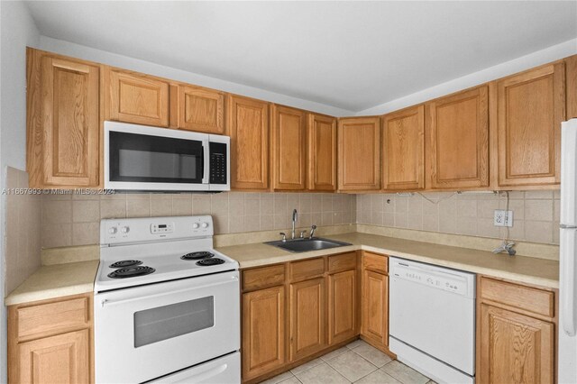1410 S Ocean Dr Unit 503, Hollywood, FL 33019 - kitchen featuring white appliances, light countertops, tasteful backsplash, and light tile patterned floors