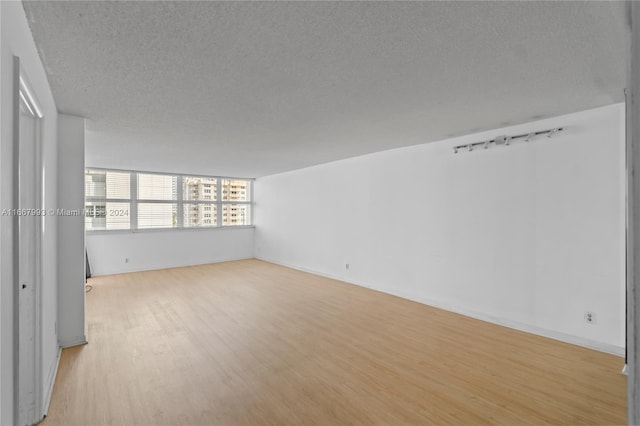 1410 S Ocean Dr Unit 503, Hollywood, FL 33019 - unfurnished room featuring a textured ceiling and light wood-style floors