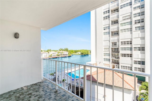 balcony featuring a water view