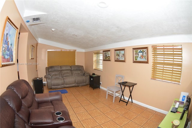 tiled living room featuring lofted ceiling and a textured ceiling