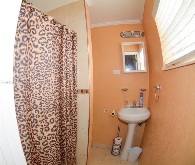 bathroom with walk in shower, ornamental molding, and tile patterned floors