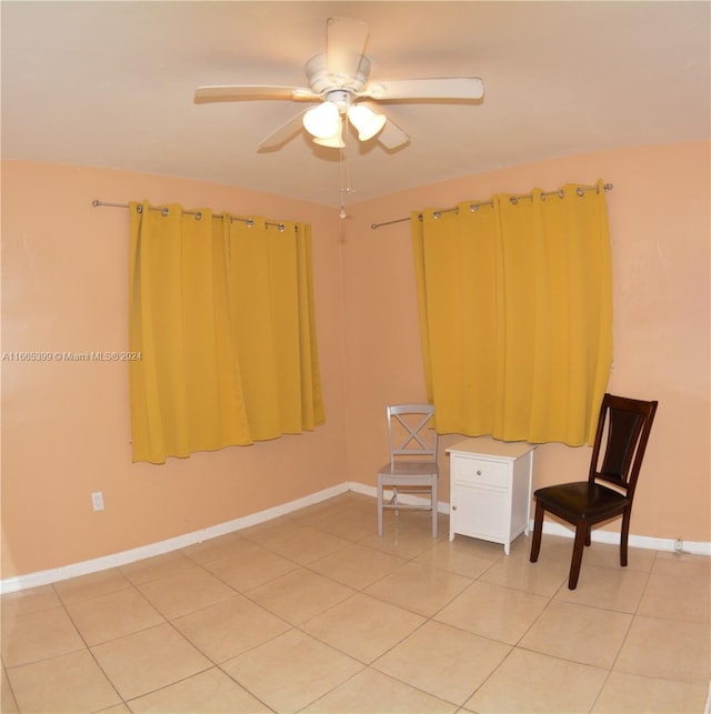 unfurnished room with tile patterned floors and ceiling fan