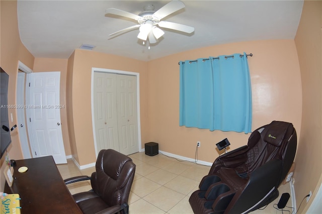 home office featuring light tile patterned flooring and ceiling fan