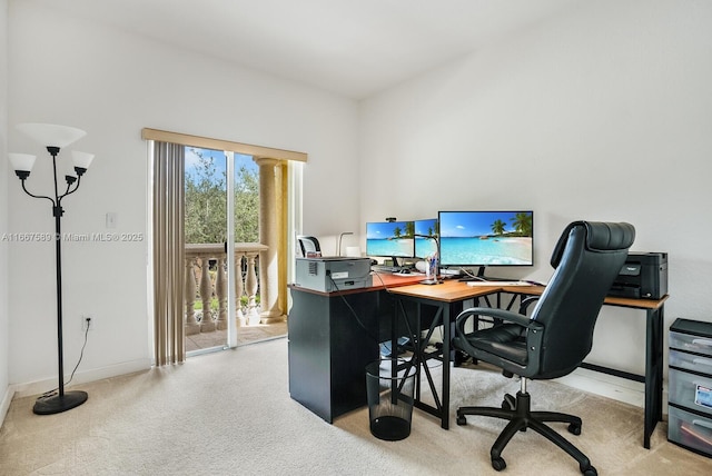 office area featuring light carpet