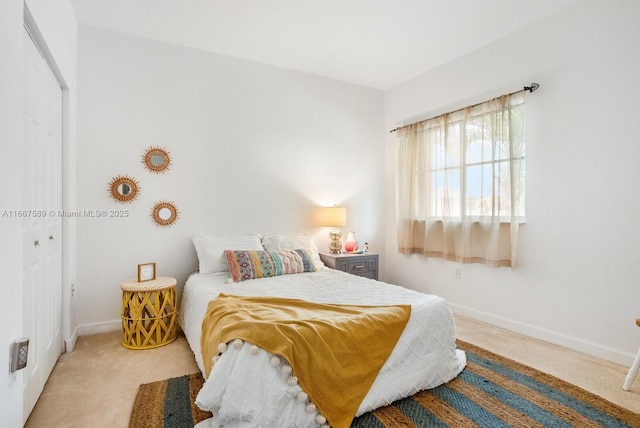 bedroom featuring carpet flooring and a closet