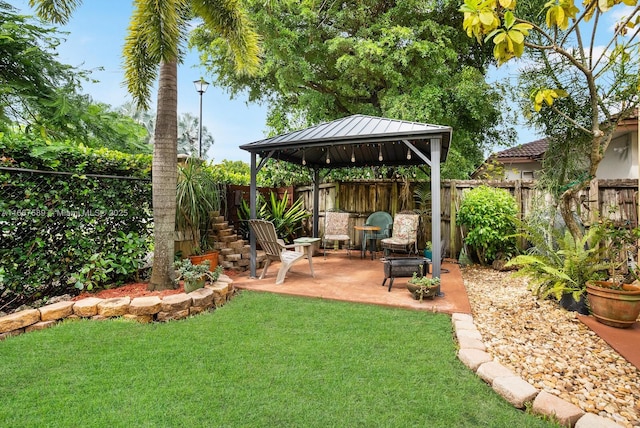 view of yard with a gazebo and a patio