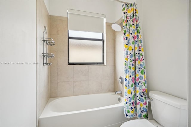 bathroom featuring toilet and shower / bath combo