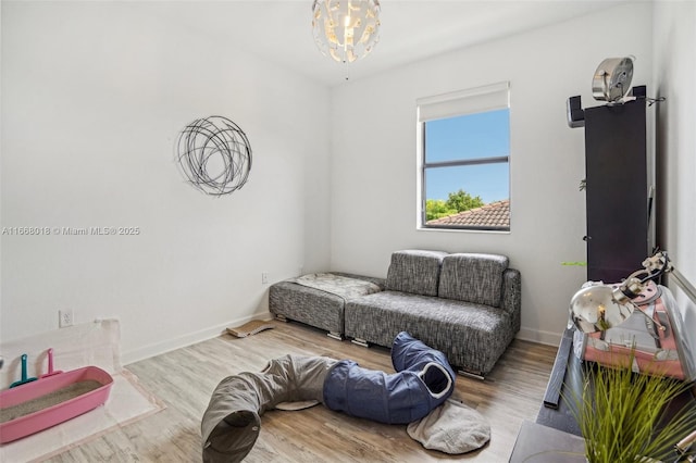 living room featuring baseboards and wood finished floors