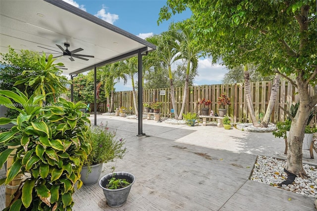 view of patio with a fenced backyard and ceiling fan