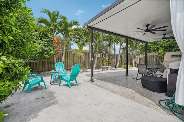 view of patio / terrace featuring a ceiling fan, outdoor dining area, and a fenced backyard