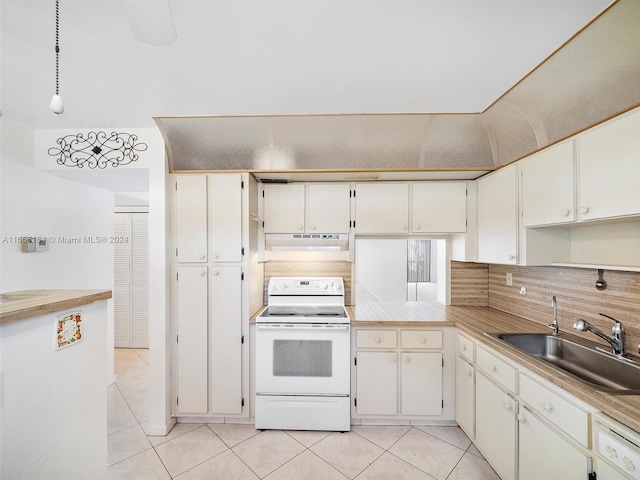 kitchen featuring white cabinetry, backsplash, white appliances, light tile patterned floors, and sink