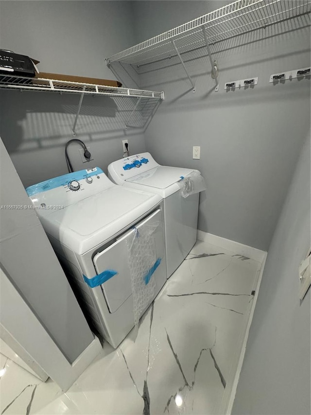 laundry area with washing machine and dryer