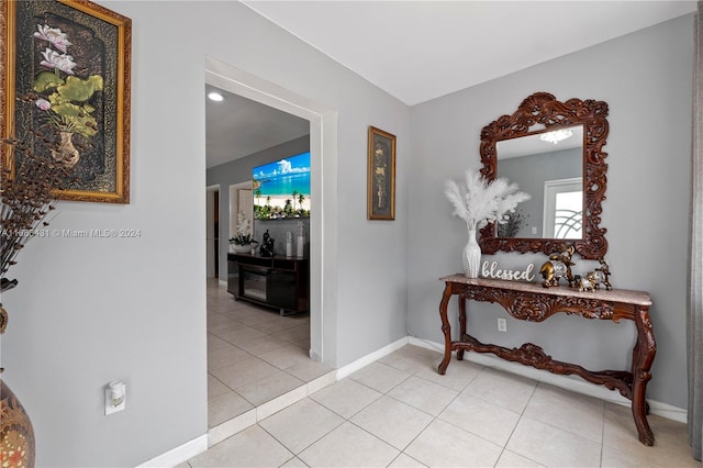 hallway featuring light tile patterned floors