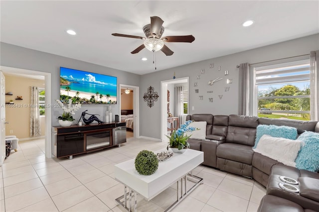 tiled living room featuring ceiling fan