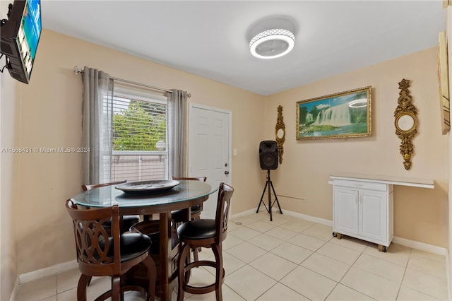 dining area with light tile patterned flooring