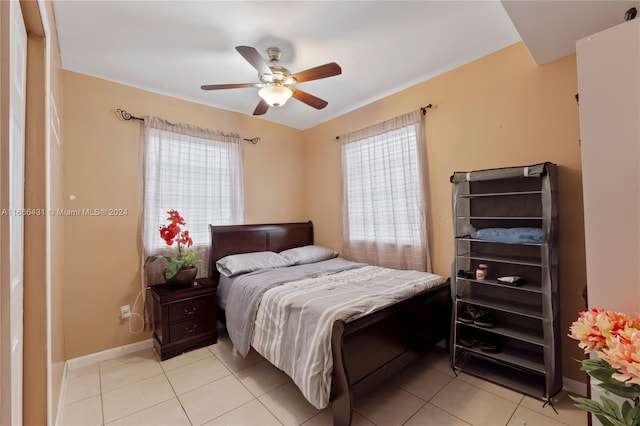 bedroom featuring ceiling fan and light tile patterned floors