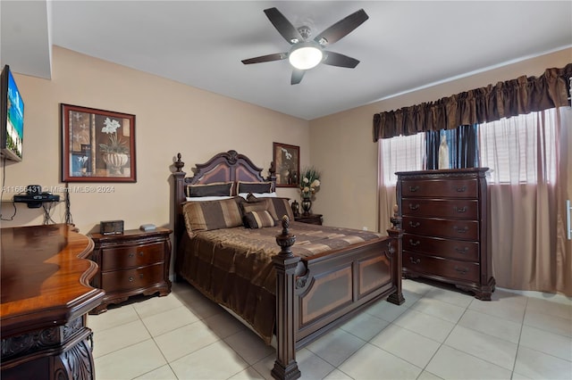 tiled bedroom featuring ceiling fan