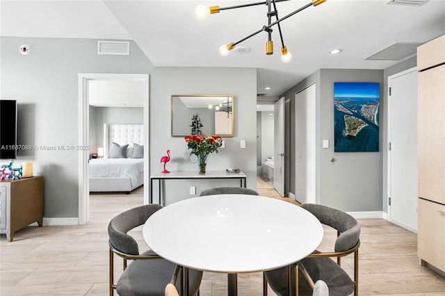 45 SW 9th St Unit 4007, Miami, FL 33130 - dining space featuring baseboards, a chandelier, and recessed lighting