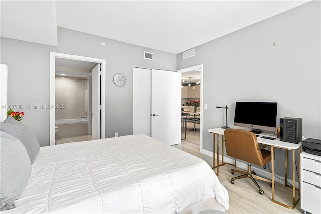 45 SW 9th St Unit 4007, Miami, FL 33130 - bedroom with wood finished floors, a desk, and ensuite bathroom