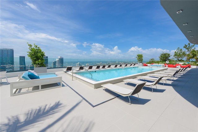 view of swimming pool featuring a patio