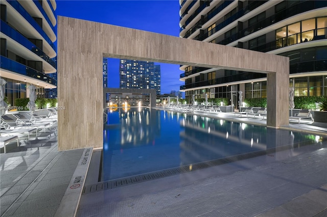 view of swimming pool with a water view