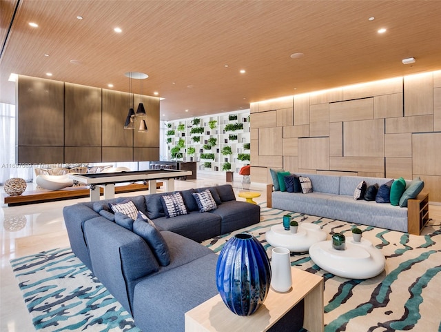 living room featuring a wall of windows, wood ceiling, and a healthy amount of sunlight