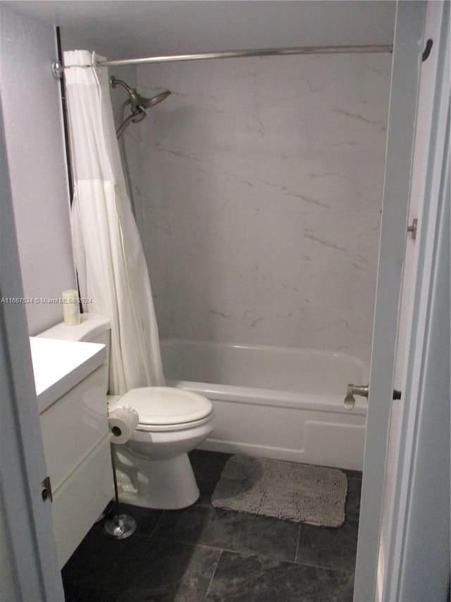 full bathroom featuring shower / bath combo, vanity, toilet, and tile patterned floors