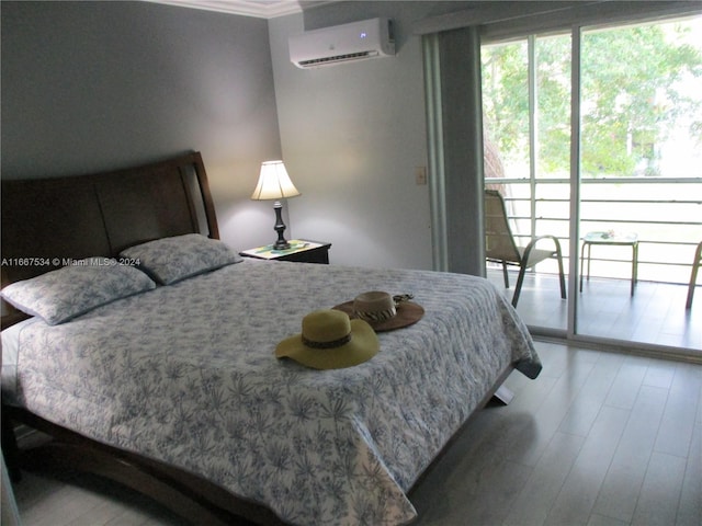 bedroom with hardwood / wood-style floors, crown molding, and a wall mounted air conditioner