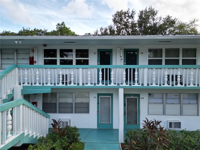 view of front of house featuring a balcony