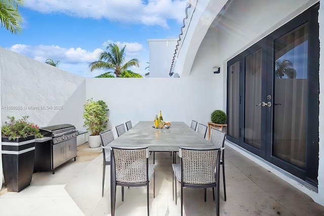 view of patio featuring a grill