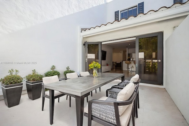 view of patio featuring outdoor dining area