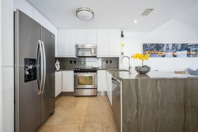 kitchen with a sink, visible vents, white cabinetry, appliances with stainless steel finishes, and open shelves