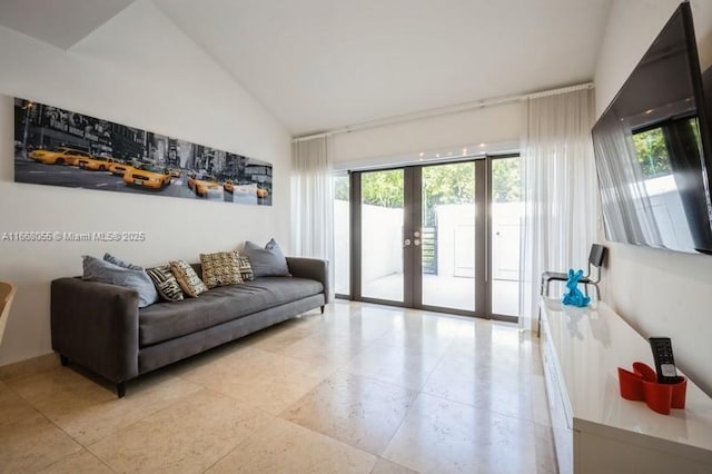 21216 Harbor Way Unit 153-15, Aventura, FL 33180 - living room with high vaulted ceiling, french doors, and plenty of natural light